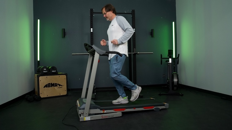 Our tester jogging on the Sunny Health & Fitness SF-T7603 Treadmill.