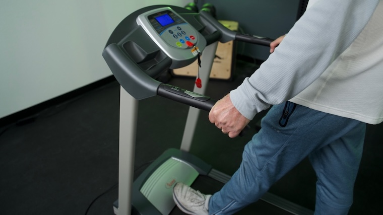 Our tester walking on the Sunny Health & Fitness SF-T7603 Treadmill.