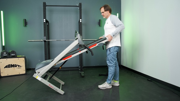 Our tester moving the Sunny Health & Fitness SF-T7603 Treadmill.