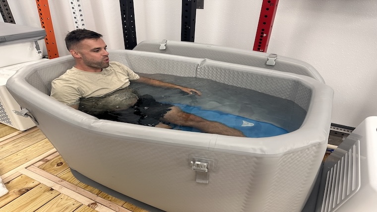 Our tester submerged in the Plunge Air cold plunge tub