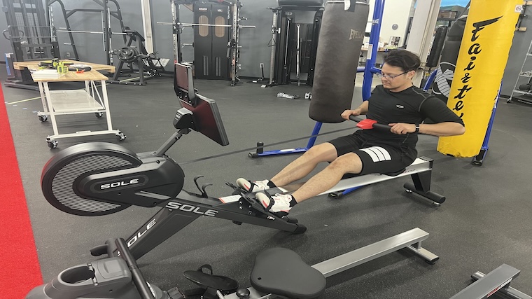 Our tester training atop the Sole SR550 rowing machine