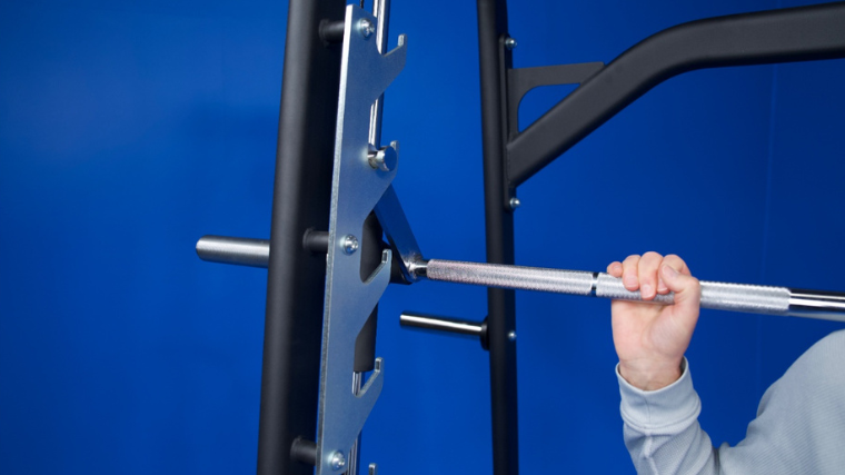 A closeup of the J-hook safeties featured on the Titan Fitness Smith Machine