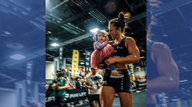 Lauren Weeks holds her child at a competition