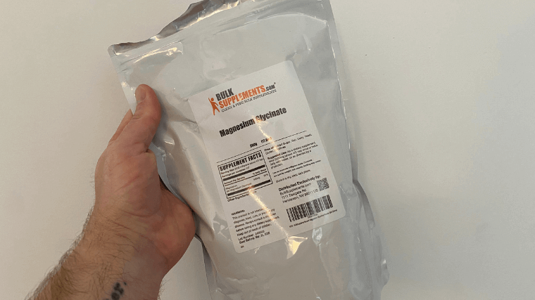 Our tester holding a bag of Bulk Supplements Magnesium Bisglycinate