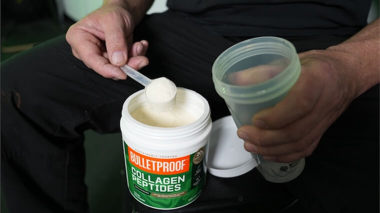 Our tester grabbing a scoop of Bulletproof Collagen Peptides