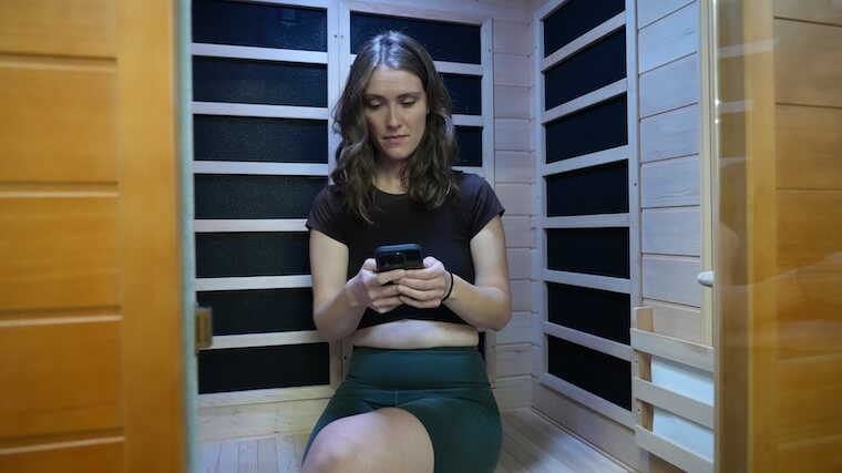 Our tester sitting inside the Dynamic Andora 2-Person Infrared Sauna