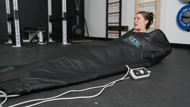 Our tester getting comfortable with the HigherDOSE Infrared Sauna Blanket