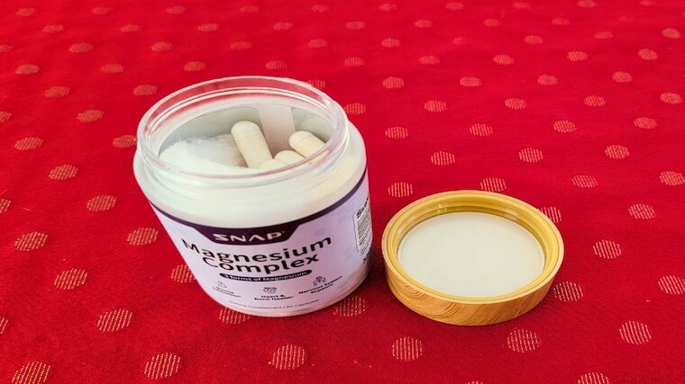 An open container of Snap Supplements Magnesium Complex