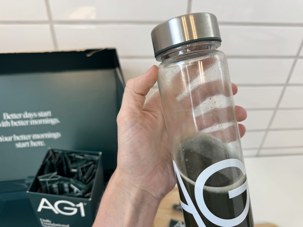 AG1 Next Gen in shaker bottle held by person