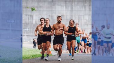 Athlete's are shown running in the CrossFit Games semifinals.