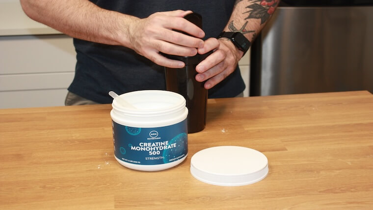 Our tester mixing a shaker of MRM Nutrition Creatine