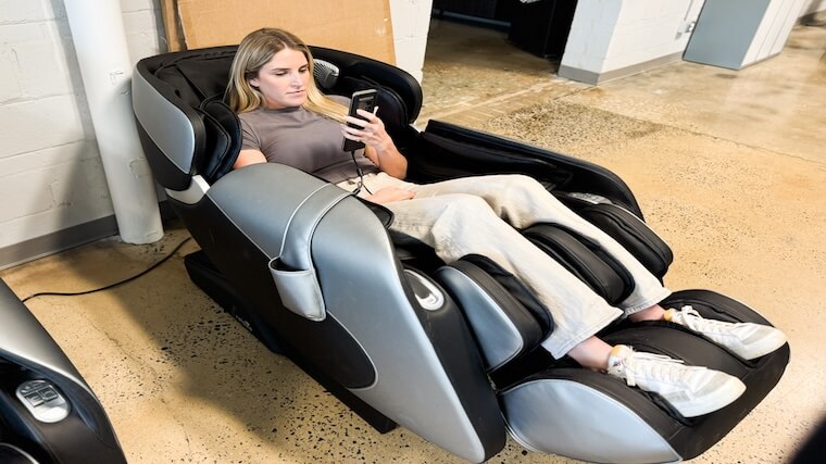 Our tester adjusting the settings on the Relaxe Zero-Gravity Shiatsu Massage Chair