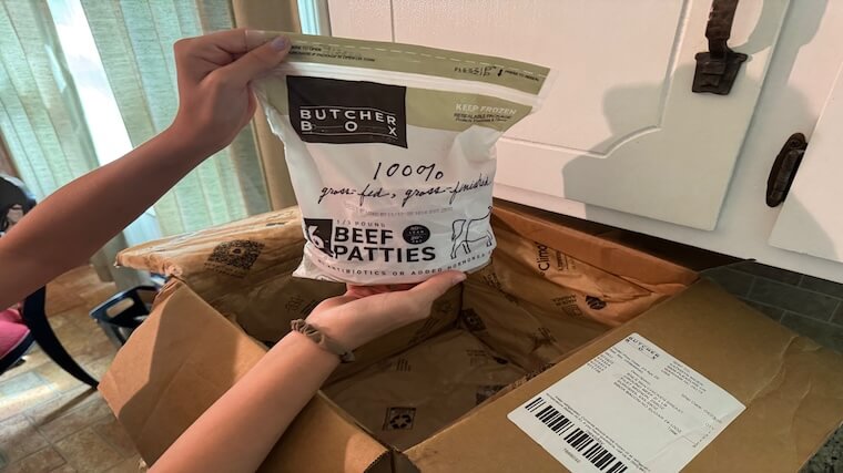 Our tester highlighting the beef patties ordered through ButcherBox