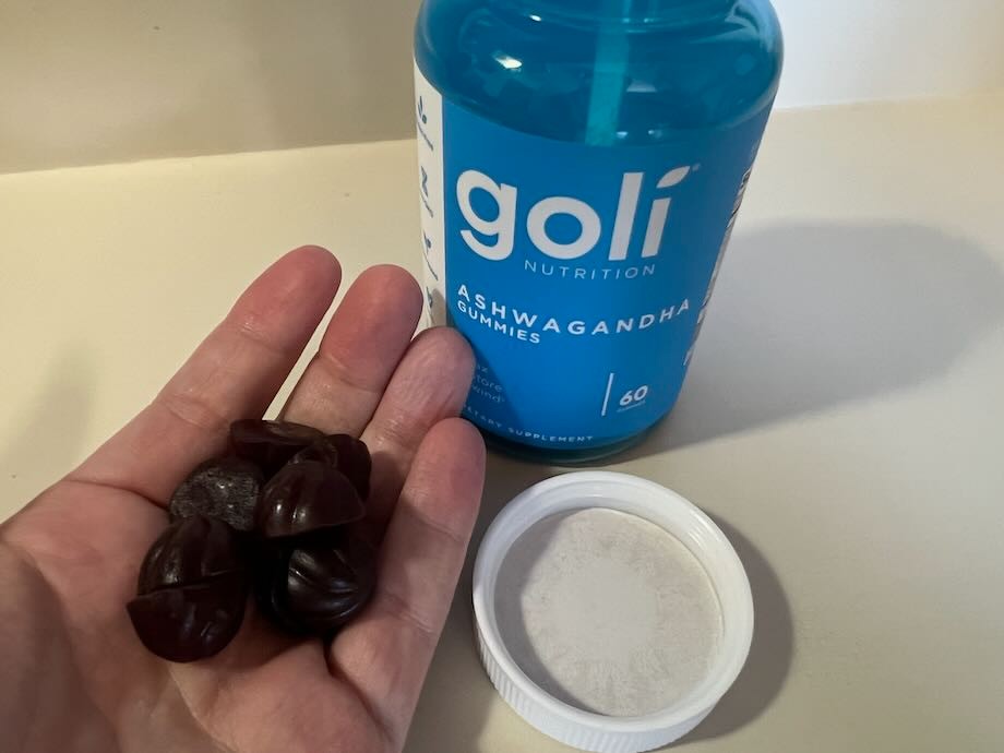 Tester holding gummies in Goli Ashwagandha review
