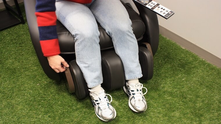 Our tester adjusting the calf massage unit featured on the Human Touch WholeBody 8.0