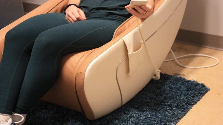 Our tester sitting in the Synca Wellness CirC Massage Chair