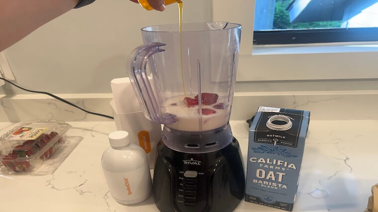 Our tester adding a serving of Spoiled Child Liquid Collagen to their morning smoothie