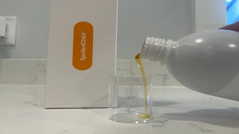 Our tester pouring a serving of Spoiled Child Liquid Collagen