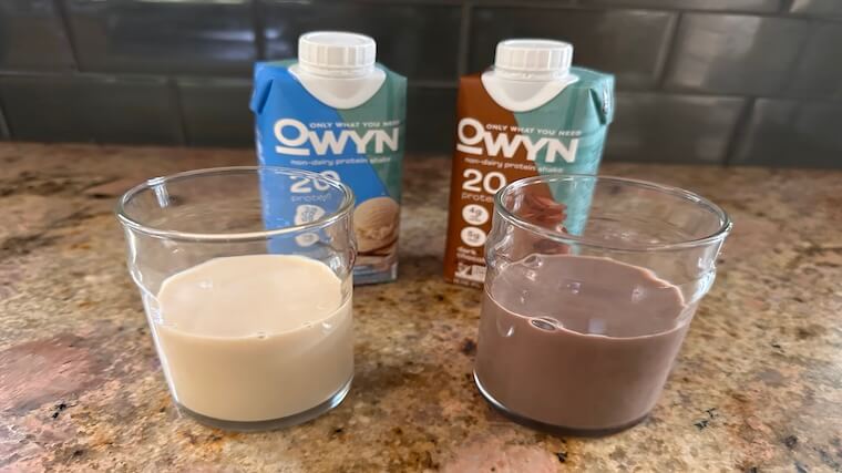 Side-by-side comparison of OWYN Vanilla and Chocolate protein shakes