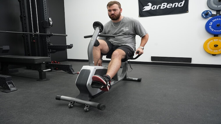 Our tester getting a workout in on the Sunny Health and Fitness Essential Recumbent Bike