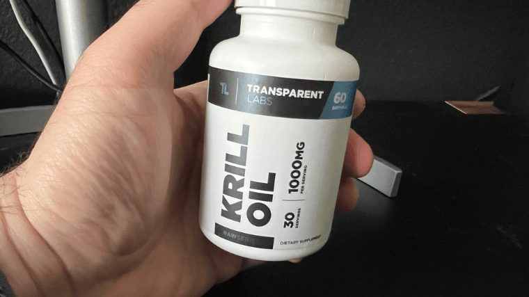 Our tester holding a bottle of Transparent Labs Krill Oil